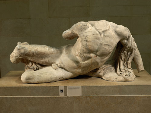 Ilissos. Marble statue of a river god from the West pediment of the Parthenon. Designed by Phidias, Athens, Greece, 438BC-432BC. Height 81cm x 189cm. © The Trustees of the British Museum.