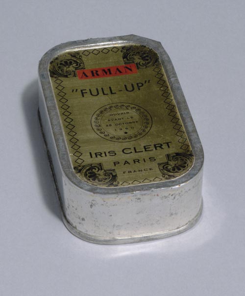 Arman. (American, born France, 1928-2005). <em>Le Plein (Full Up)</em>, 1960. Multiple of sardine can filled with trash and exhibition invitation, overall: 4 1/8 x 2 x 1 1/8 in (10.5 x 6.4 x 2.9 cm). Publisher: Galerie Iris Clert, Paris. Fabricator: the artist and Galerie Iris Clert, Paris. Edition: 1,500; plus 500 signed and numbered. The Museum of Modern Art, New York. The Associates Fund, 2006. © 2006 Artists Rights Society (ARS), New YorkADAGP, Paris.