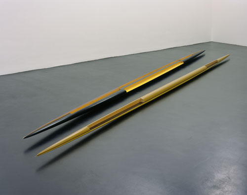 Isa Genzken. Rot-gelb-schwarzes Doppelellipsoid ‘Zwilling’ (Red-Yellow-Black Double Ellipsoid “Twin”), 1982. Lacquered wood, two parts. Overall: 24 x 33.5 x 1202.1 cm Part one: 13 x 20.5 x 600 cm Part two: 11 x 14 x 602 cm. Collection of the artist. Courtesy the artist and Galerie Buchholz, Cologne/Berlin. © Isa Genzken