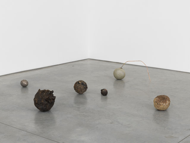 Jay Heikes. Minor Planets, 2017. Group of six orbs; steel slag, glue, gladstone orb, cast bronze, lignum vitae, cast bismuth, aluminium, copper, dimensions variable. Courtesy of the artist and Marianne Boesky Gallery, New York and Aspen. © Jay Heikes. Photograph: Jason Wyche.