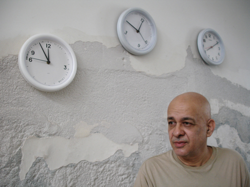Cildo Meireles. The clocks in the background are part of Fontes (1992/2008) installation.
