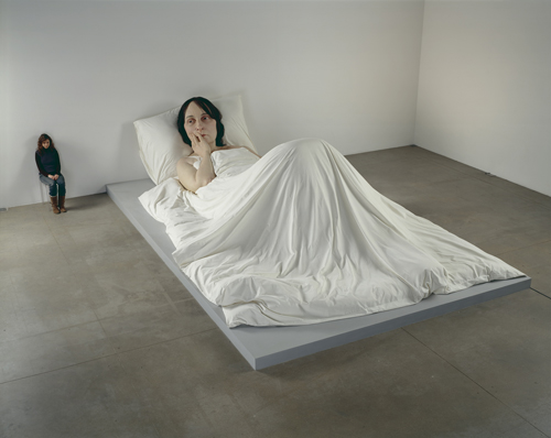 Ron Mueck. <em>In Bed</em>, 2005. Mixed media. 162 x 650 x 395cm © Ron Mueck, courtesy Anthony d'Offay, London. Photographer: Mike Bruce, Gate Studios, London.