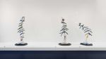 Magali Reus, three sculptures from the Streamers series (2025), Sprayed polyester; sprayed, sanded and waxed polyester; acrylic resin; screen- printed card; pigments; sprayed aluminium tubing; polished graphite-coated CNC’d MDF; sanded and patinated laser-cut brass; brass bolts and rivets; laser-cut steel, cast concrete; MDF; paint. Varied dimensions. Installation view at The Perimeter. © Magali Reus. All works courtesy of the Artist, The Approach, London; Tanya Bonakdar Gallery, NYC, USA; Galerie Greta Meert, Brussels; Mai 36 Galerie, Zurich. Photo: Eva Herzog.