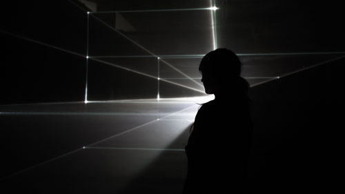 United Visual Artists: Vanishing Point. Installation view (2), 2013. RGB laser, black voile, code. Photo courtesy of the artists.