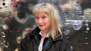 Verran paints large atmospheric spaces filled with small, often cryptic, graphic details. She explains why she doesn’t see herself as an abstract artist, but desires to keep the viewer on their toes – or even on ‘metaphorical barbed wire’