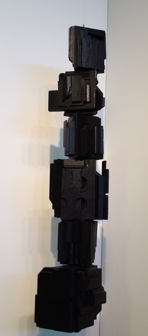 Louise Nevelson. <em>Rain Forest,</em> c1967. Wood, painted black, with hanging moveble elements, 40½ x 10 x 10 in. Hirschl & Adler Modern. Photograph: Miguel Benavides.
