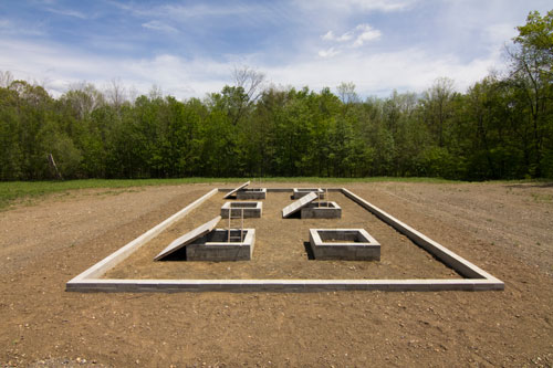 Alice Aycock. A Simple Network of Underground Wells and Tunnels, 1975/2012. Concrete, wood, earth, approximately 28’ x 50’ x 9’ deep. Originally sited at Merriewold West, Far Hills, New Jersey, (destroyed); Permanently reconstructed at The Fields Omi/Architecture Omi, Ghent, NY, 2011. Photograph: Dave Rittinger.