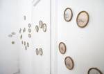 Alice Schivardi. Coccinelle (Ladybugs), 2010. 32 pieces: embroidery and pencil on vellum, curved glass, resin frames on vellum, 100 x 300 cm (installation). Copyright the artist. Courtesy Richard Saltoun Gallery.