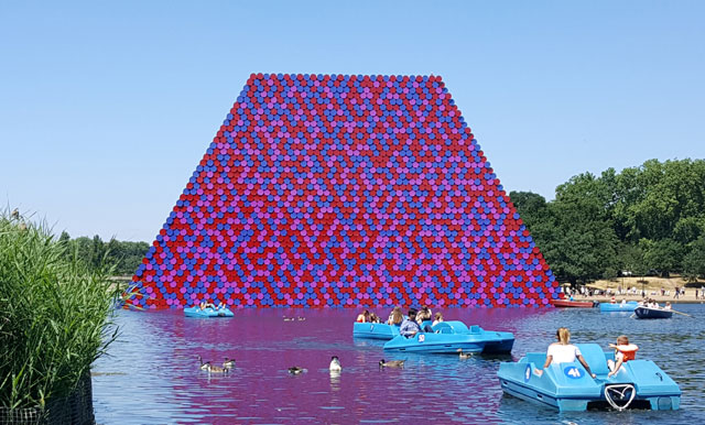 Christo. The London Mastaba, Serpentine Lake, Hyde Park, 2016-18. Temporary floating sculpture, 7,506 horizontally stacked barrels on a floating platform, 20(h) x 30(w)x 40(l) m, 600 metric tonnes. Photo: Miguel Angel.