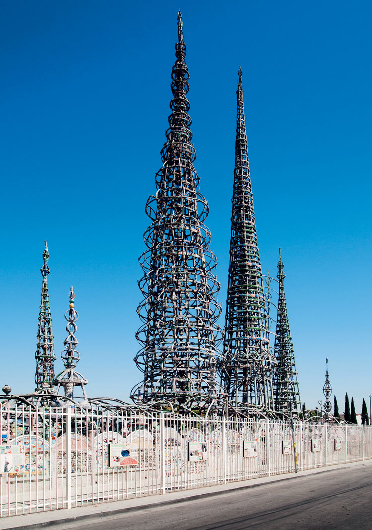 Simon Rodia, Watts Towers, 1921-54. Los Angeles. Concrete, bottles, cups, glass, tile, shells, steel, wire mesh, 1⁄10 of an acre, height of the tallest tower is 99 ½ ft (33.3 m). Photo: CDS Images/Alamy Stock Photo.