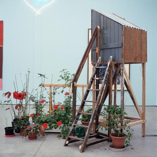 Tracey Emin. The Perfect Place to Grow, 2001. Mixed media: wooden birdhouse, DVD (1 minute 45 seconds), monitor, trestle, plants and ladder, 261 x 82.5 x 162. Tate: purchased 2004. © The Artist