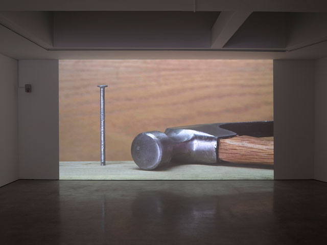 Ceal Floyer. Hammer and Nail, 2018. Video projection with audio, 
dimensions variable. © Ceal Floyer. Courtesy Lisson Gallery.