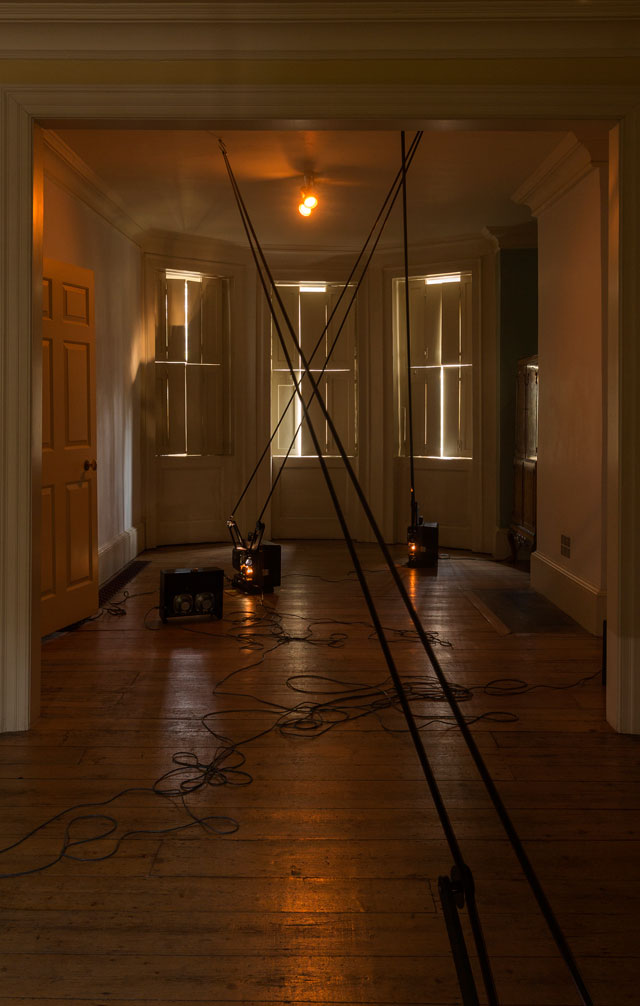 Louisa Fairclough. FEAR LIFE DEATH HOPE, 2017. 4 x 16mm projectors, 4 x film loops with optical sound suspended from meat hooks. Installation view: A Song cycle for the Ruins of a Psychiatric Unit, Danielle Arnaud Gallery, 2017. Photograph: Oskar Proctor. Courtesy the artist and Danielle Arnaud.