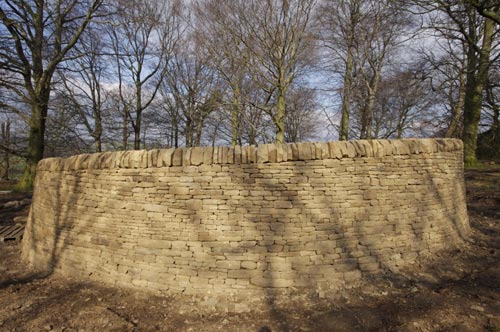 Andy Goldsworthy. <em>Outclosure</em>, 2007. Round wood and Yorkshire sandstone, quarried by Johnson’s Wellfield, Huddersfield. Sited with permission of Job Earnshaw and Bros Ltd. Photo: Jonty Wilde.