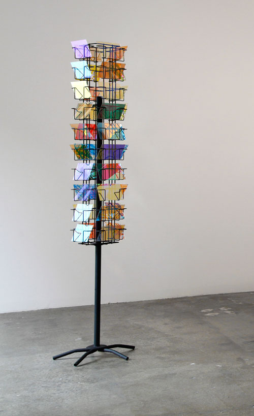 Stephen Dean. Prayer Mill, 2009. Metal structure and dichroic glass, (40 panels of 4 x 6 in) 72 x 10 in x 10 in.