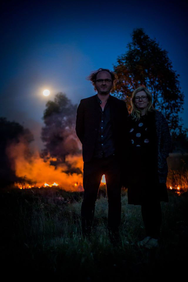 Vic and Sarah – Image: Barbara Bartos and Vic McEwan - Cad Factory Artist Director Vic McEwan with Creative Producer Sarah McEwan in front of traditional burning techniques being trialled by Graham Strong, 2006.