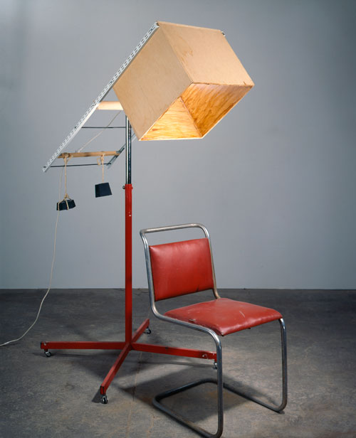 Sarah Lucas. <em>Portable Smoking Area</em>, 1996. Wood, chair, weights, chrome stand, shellac, 180 x 76 x 140 cm. Collection of Ursula Blickle. Copyright the artist, courtesy Sadie Coles HQ, London.