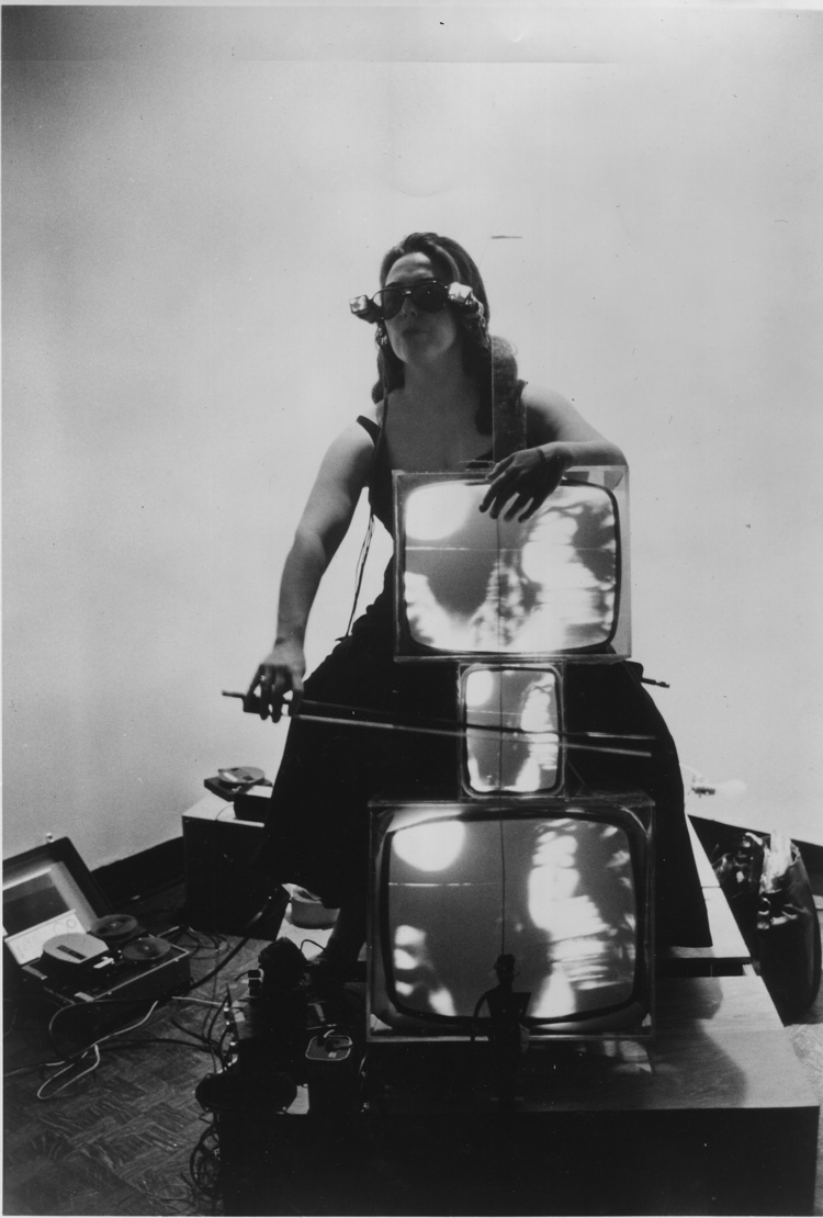 Nam June Paik. Charlotte Moorman with TV Cello and TV Eyeglasses, 1971. Photograph, gelatin silver print. Lent by the Peter Wenzel Collection, Germany.