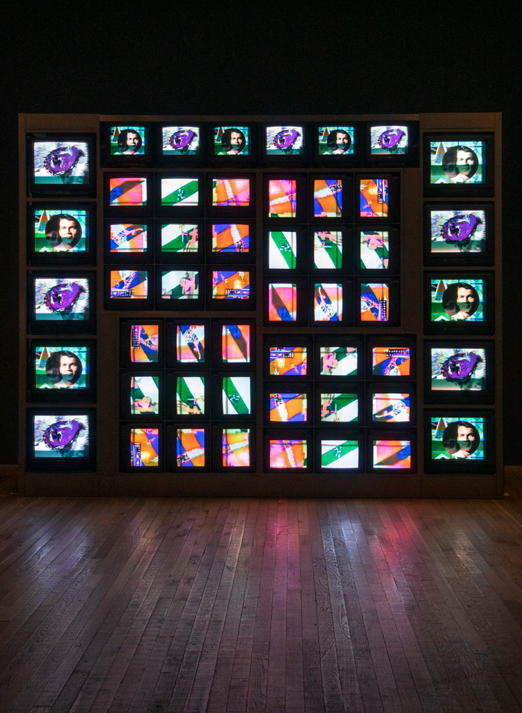 Nam June Paik. Internet Dream 1994. Install view, Tate Modern 2019. Ten 20-inch cathode-ray tube televisions, forty-two 13-inch cathode-ray tube televisions,custom-made video wall system, steel frame and three video channels, colour, sound, 287 x 380 x 80 cm. ZKM Centre for Art and Media, Karlsruhe.