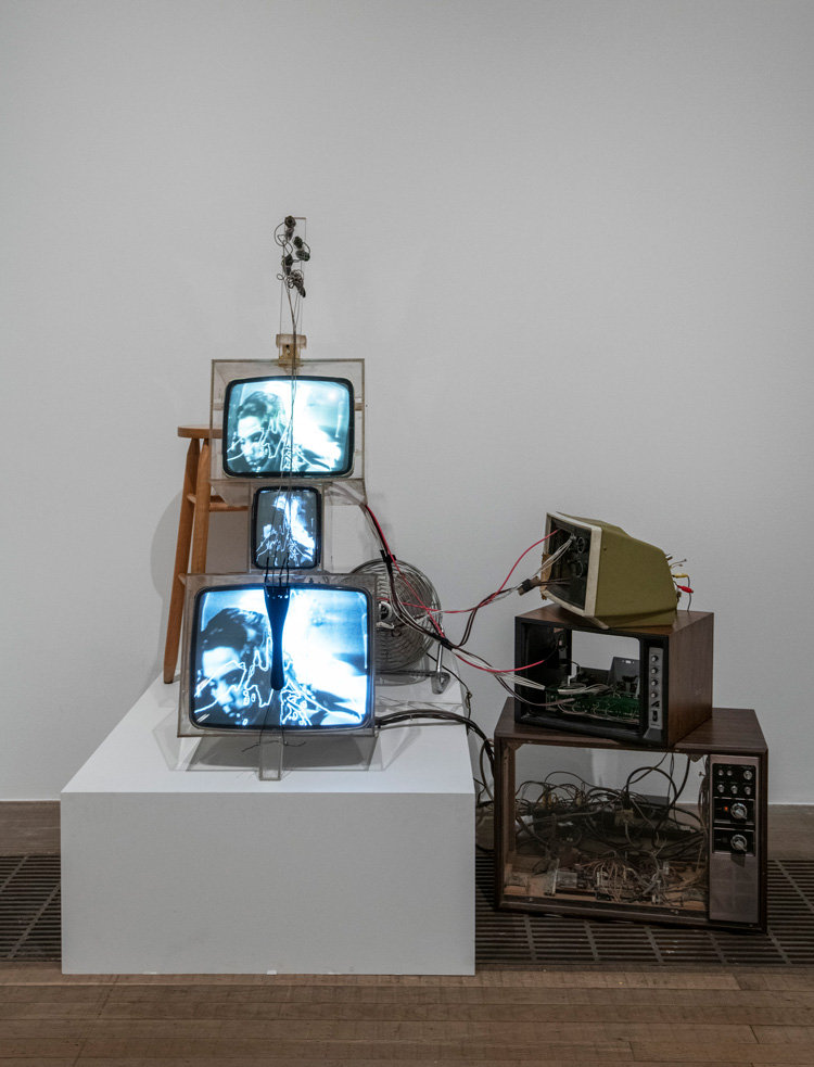 Nam June Paik. TV Cello 1971. Installation view, Tate Modern 2019. Three cathode-ray tubes, acrylic boxes, three television casings, electronics, wiring, wood base, fan and stool. Walker Art Center, T. B. Walker Acquisition Fund, 1992, Minneapolis. Formerly the collection of Otto Piene and Elizabeth Goldring, Massachusetts. Photo: © Tate (Andrew Dunkley). Photo: © Tate (Andrew Dunkley).