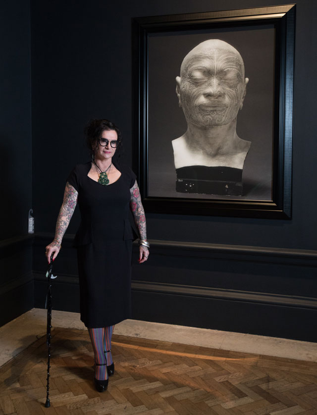 Fiona Pardington, in front of Portrait of a life-cast of Matoua Tawai (The Pressure of Sunlight Falling series), 2010, in the Memory and Commemoration room, Oceania exhibition, Royal Academy of Arts, London, 29 September – 10 December 2018. © courtesy of the artist and Starkwhite, New Zealand. Photo: David Parry.