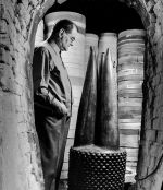 Axel Salto looking at the sculpture The Core of Power in the kiln, 1956. CLAY - Royal Copenhagen Collection. Photo by Aage Strüwing. © Axel Salto/VISDA.
