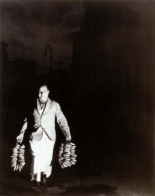 Weegee. <em>Max Is Rushing in the Bagels to a Restaurant on Second Avenue for the Morning Trade</em>, c1940. Gelatin silver print. The Jewish Museum, New York, Purchase: Joan B. and Richard L. Barovick Family Foundation and Bunny and Jim Weinberg Gifts. © Weegee/International Center of Photography/Getty Images.