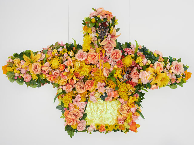 Devon Shimoyama, February II, 2019. Silk flowers, rhinestones, jewellery, sequins, and embroidered patch on cotton hoodie with steel armature, coated wire and fishing line, 45 x 72 x 12 in (114.3 x 182.9 x 30.5 cm). Image courtesy De Buck Gallery, New York.