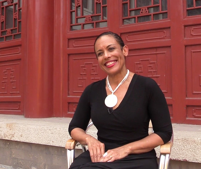 Toni Scott talking to Studio International at the opening of DNA – Bloodlines and the Family of Mankind, Arthur M Sackler Museum of Art and Archaeology at Peking University, 6 July 2015. Photo: Martin Kennedy.