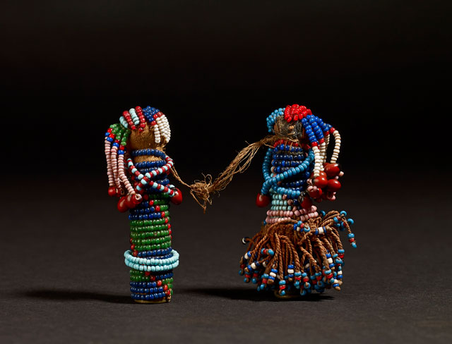 Pair of Sotho Gun Cartridge Dolls. Glass, brass and leather, South Africa, late 19th century. © The Trustees of the British Museum.