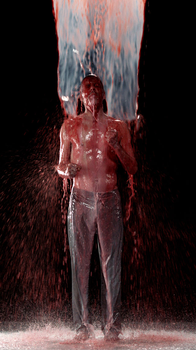 Bill Viola. Inverted Birth, 2014. Video/sound installation. Colour high-definition video projection on screen mounted vertically and anchored to floor in dark room; stereo sound with subwoofer, projected image size: 16 ft 5 in x 9 ft 3 in (5 x 2.82 m), 8:22 minutes. Performer: Norman Scott.
