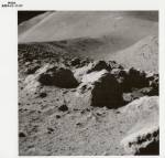 Lunar boulders, St George Crater beyond, Apollo 15, July 1971, Vintage gelatin silver print, c20 x 25cm, NASA AS15-82-11147. Courtesy Breese Little.