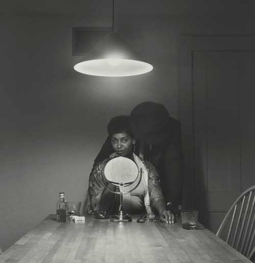 Carrie Mae Weems. Untitled (Man and mirror) (from Kitchen Table Series), 1990. Gelatin silver print, 27 1/4 x 27 1/4 inches (69.2 x 69.2 cm). Collection of Eric and Liz Lefkofsky, Promised gift to The Art Institute of Chicago. © Carrie Mae Weems Photograph: © The Art Institute of Chicago.